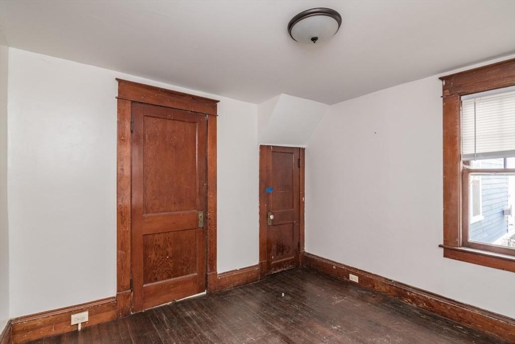 110 Old Amherst Road Sunderland, MA 01375 - Photo 20 of 41 an empty room with wooden floor and windows