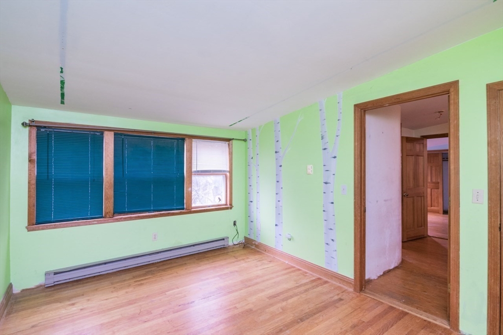 110 Old Amherst Road Sunderland, MA 01375 - Photo 27 of 41 an empty room with closet and windows