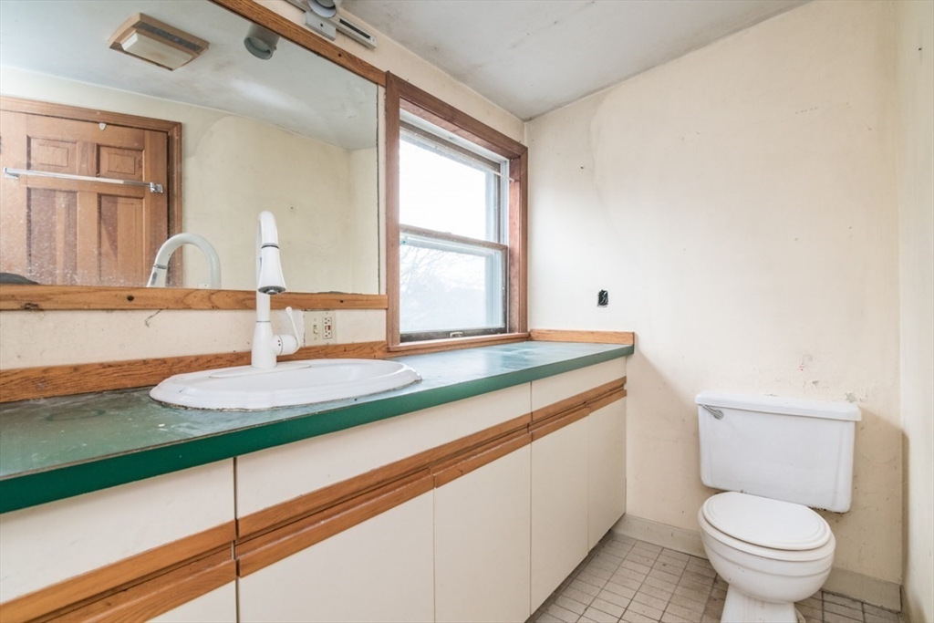 110 Old Amherst Road Sunderland, MA 01375 - Photo 28 of 41 a bathroom with a granite countertop toilet sink and mirror