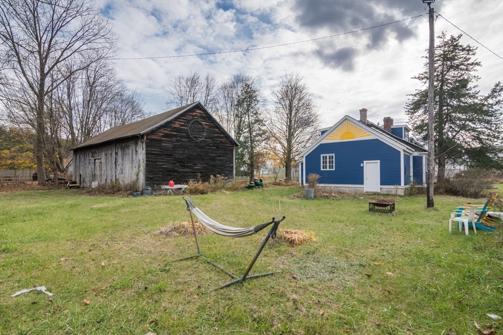 110 Old Amherst Road Sunderland, MA 01375 - Photo 41 of 41 a brick house with garden in front of it