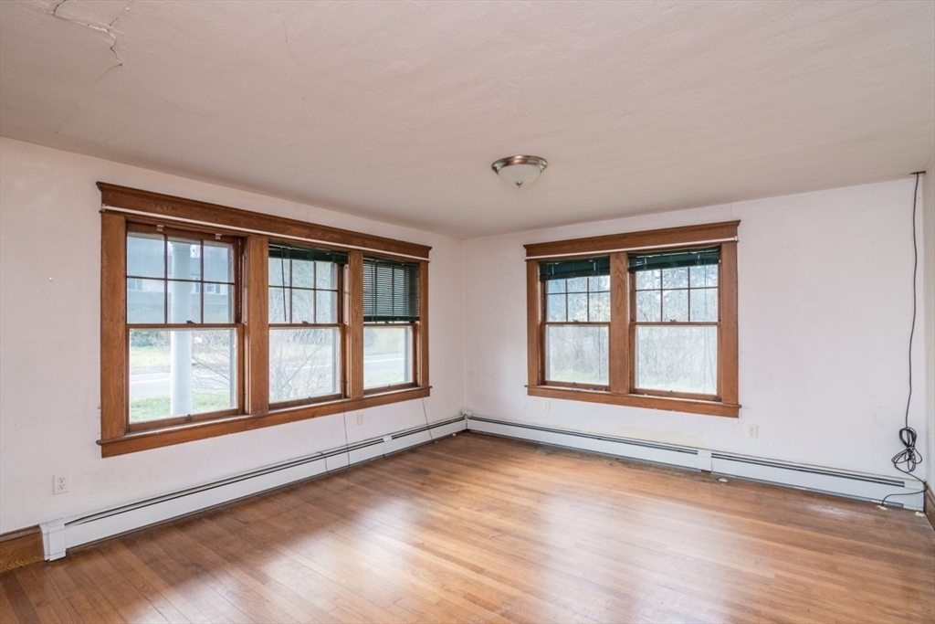 110 Old Amherst Road Sunderland, MA 01375 - Photo 6 of 41 a view of an empty room with a window and wooden floor