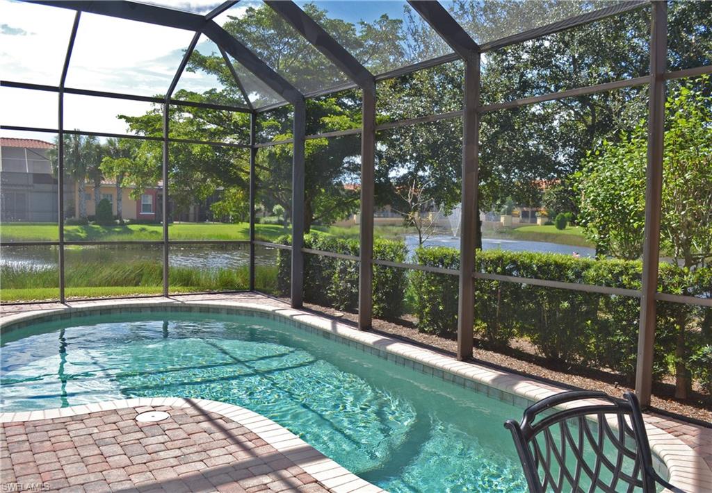 22160 Ponte Romano Lane Estero, FL 33928 - Photo 15 of 17 a view of a backyard with a garden and plants