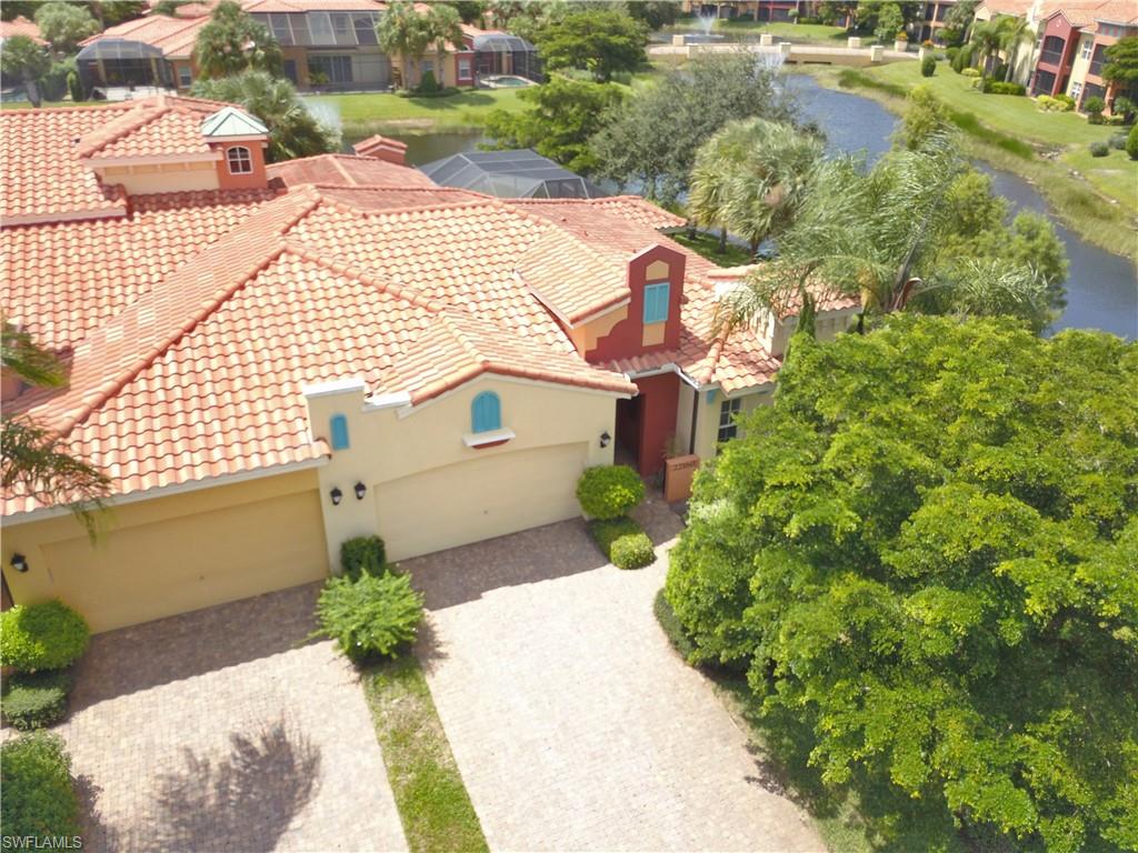 22160 Ponte Romano Lane Estero, FL 33928 - Photo 2 of 17 a front view of a house with garden