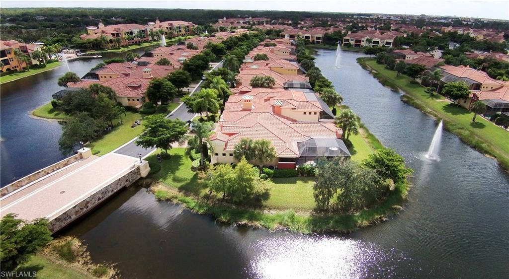 22160 Ponte Romano Lane Estero, FL 33928 - Photo 4 of 17 an aerial view of lake residential house with swimming pool and outdoor space