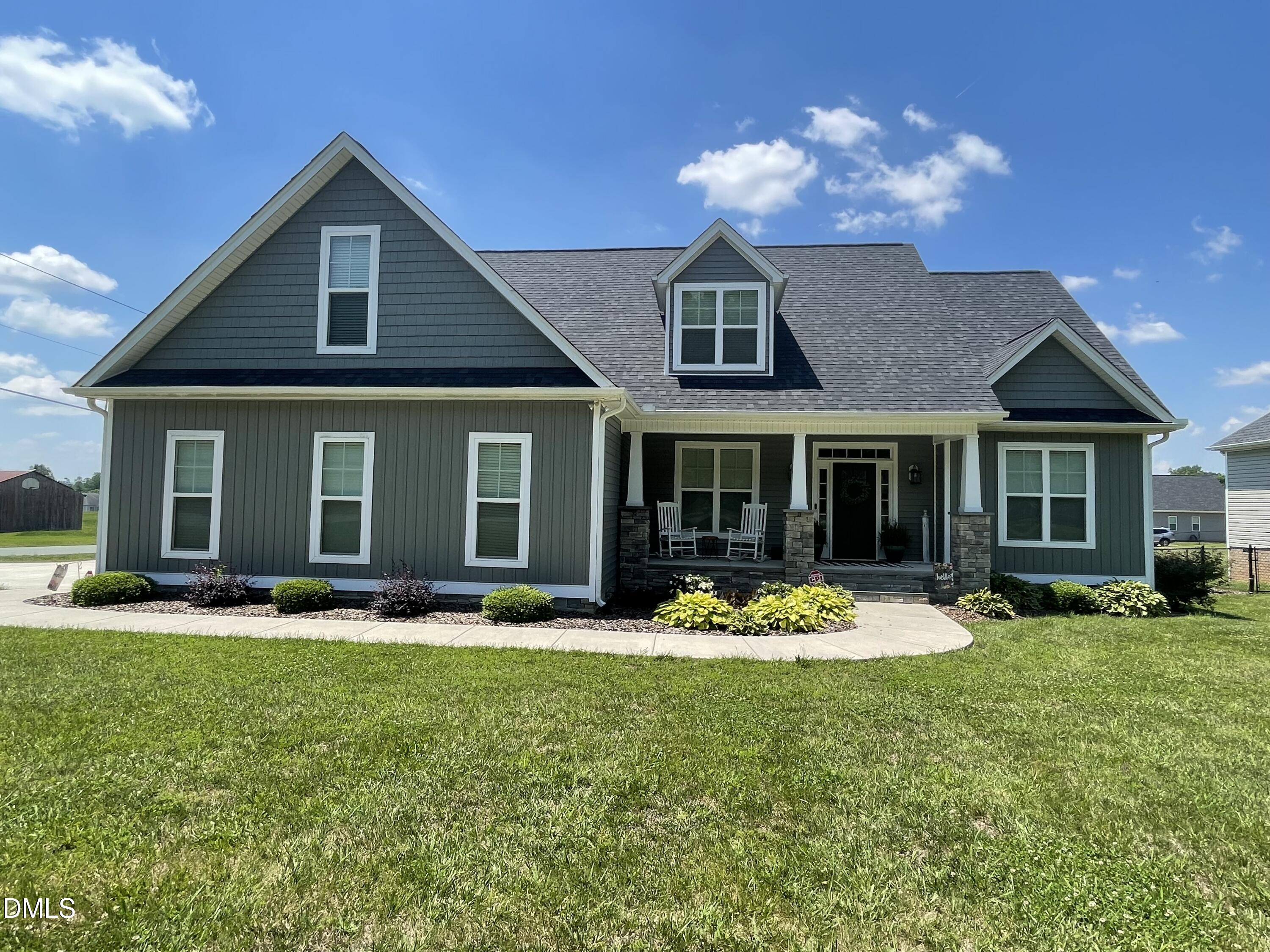 2265 Lacy Holt Road Graham, NC 27253 - Photo 1 of 43 a front view of a house with a yard and trees