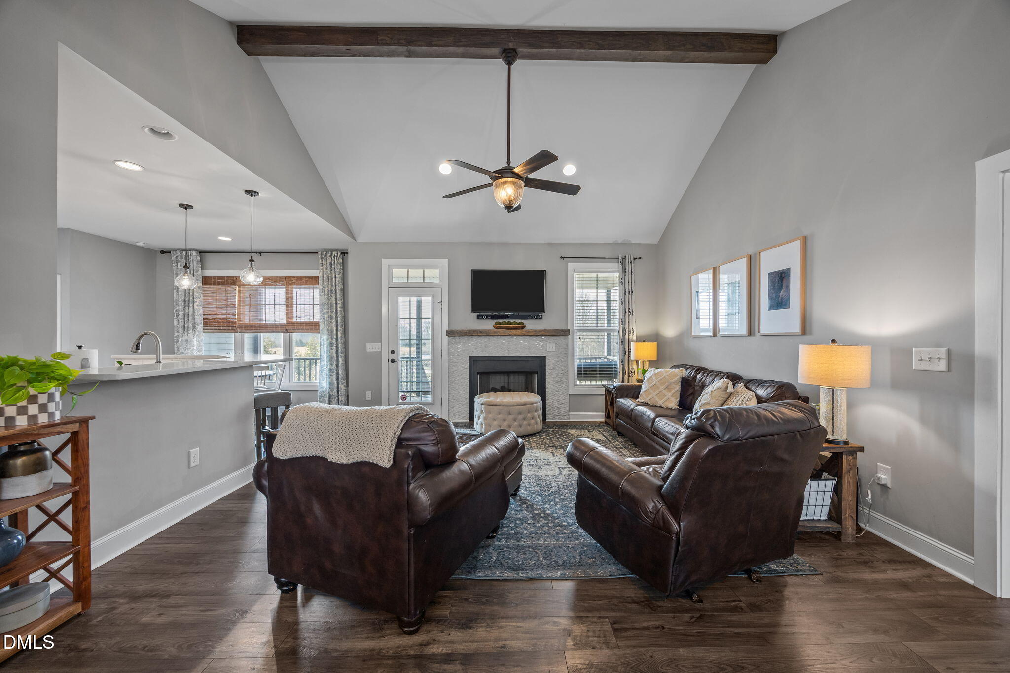 2265 Lacy Holt Road Graham, NC 27253 - Photo 12 of 43 a living room with furniture a fireplace and a flat screen tv
