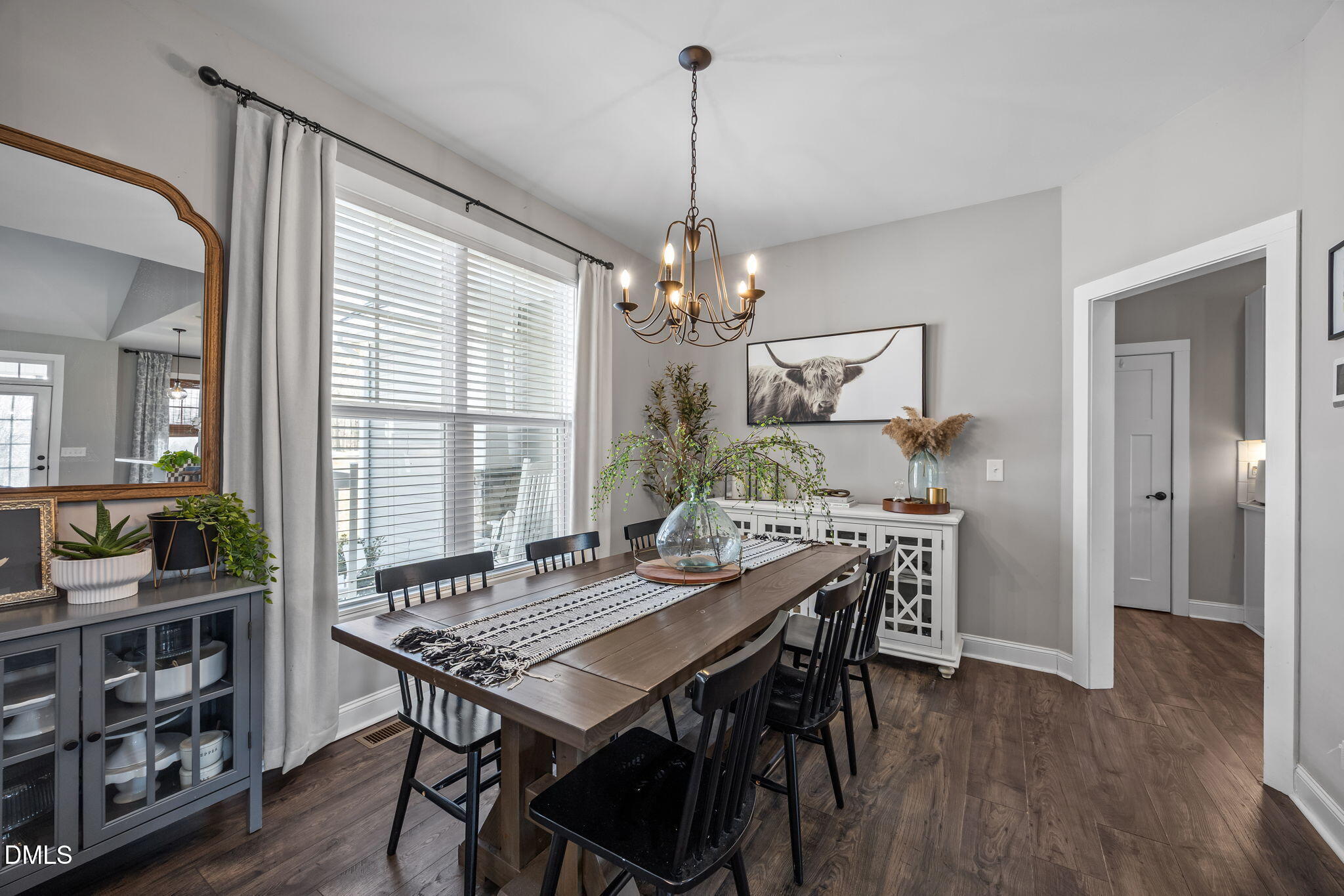 2265 Lacy Holt Road Graham, NC 27253 - Photo 13 of 43 a view of a dining room with furniture window and wooden floor