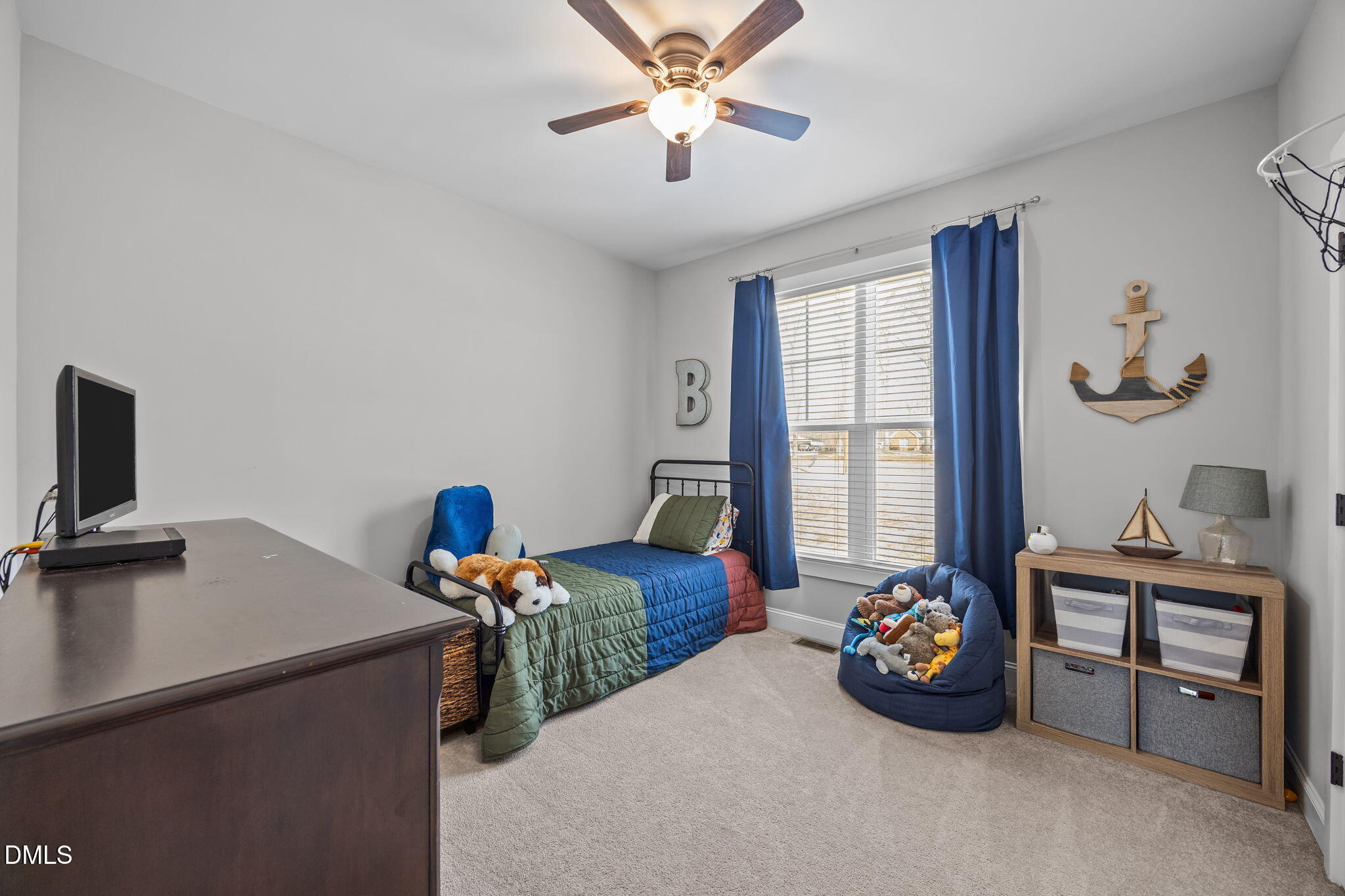 2265 Lacy Holt Road Graham, NC 27253 - Photo 18 of 43 a bedroom with furniture and a window