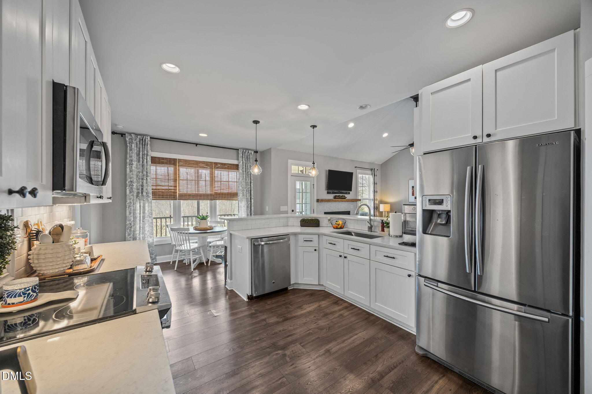 2265 Lacy Holt Road Graham, NC 27253 - Photo 19 of 43 a kitchen with stainless steel appliances a refrigerator sink and microwave