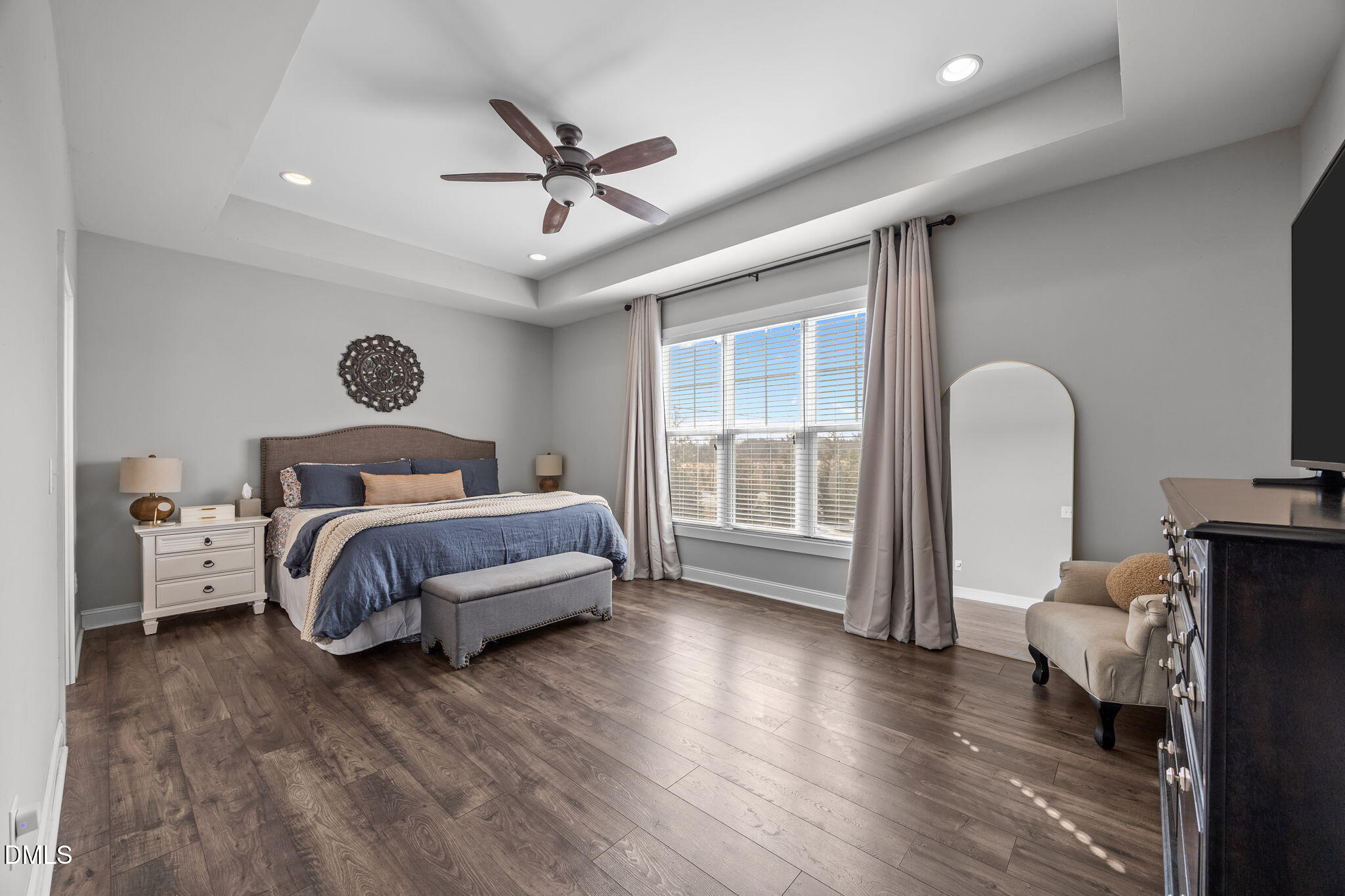 2265 Lacy Holt Road Graham, NC 27253 - Photo 26 of 43 a bedroom with a bed and a chandelier