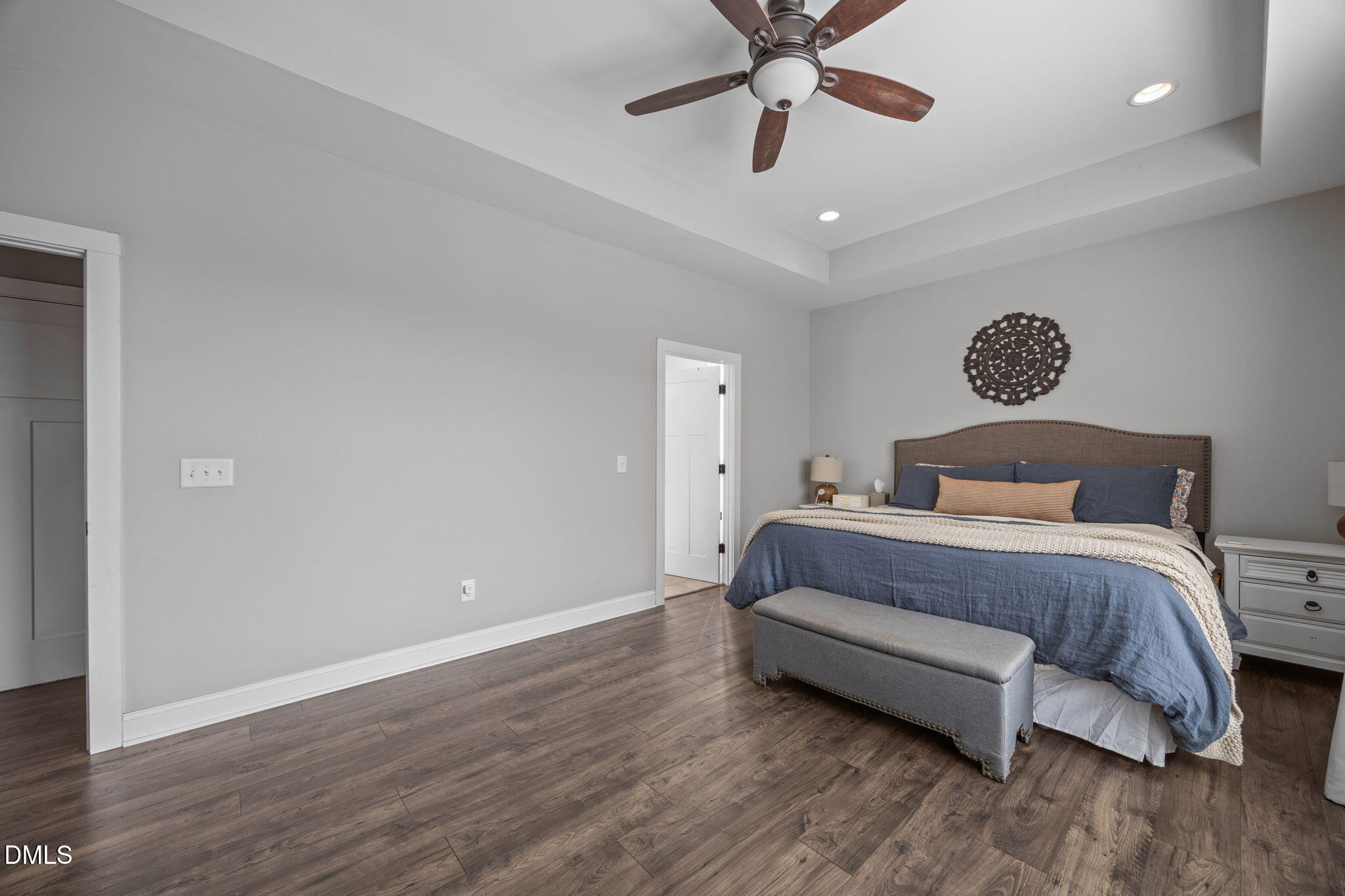 2265 Lacy Holt Road Graham, NC 27253 - Photo 27 of 43 a bedroom with a bed and a ceiling fan