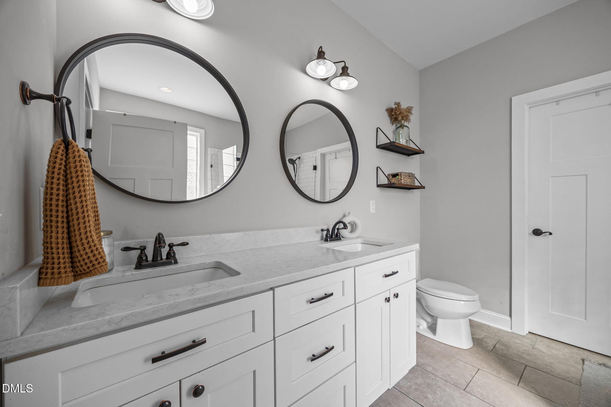 2265 Lacy Holt Road Graham, NC 27253 - Photo 28 of 43 a bathroom with a granite countertop toilet a sink and a mirror