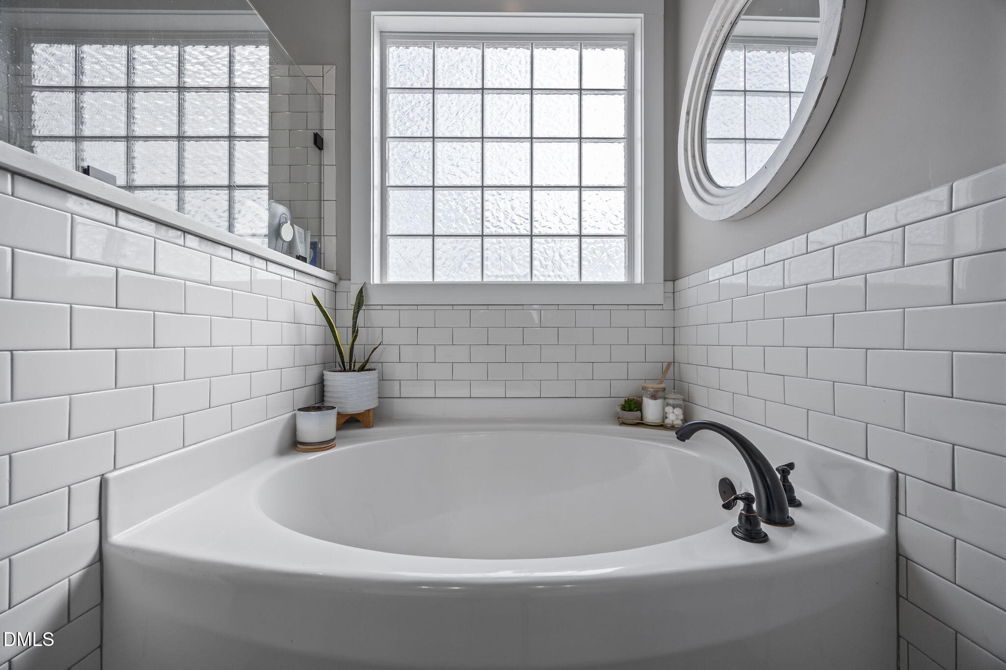 2265 Lacy Holt Road Graham, NC 27253 - Photo 30 of 43 a bathroom with a bathtub and a shower