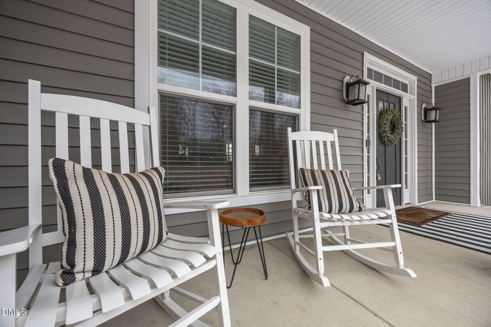 2265 Lacy Holt Road Graham, NC 27253 - Photo 7 of 43 a view of a chair and tables in the back yard of the house