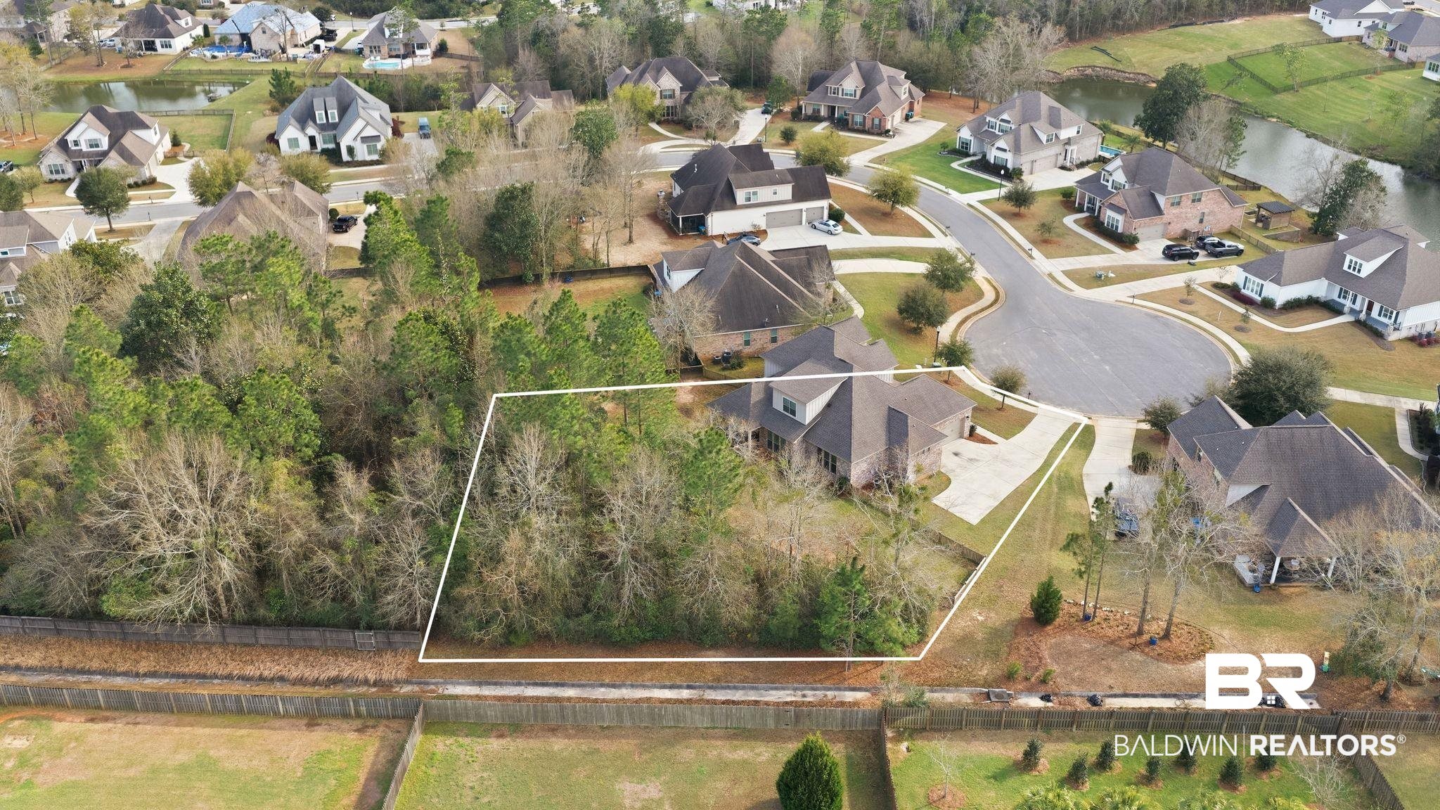 32194 Badger Court Daphne, AL 36527 - Photo 47 of 49 Aerial perspective of suburban area with property boundaries highlighted and a large body of water