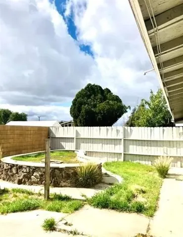 a view of swimming pool with a yard