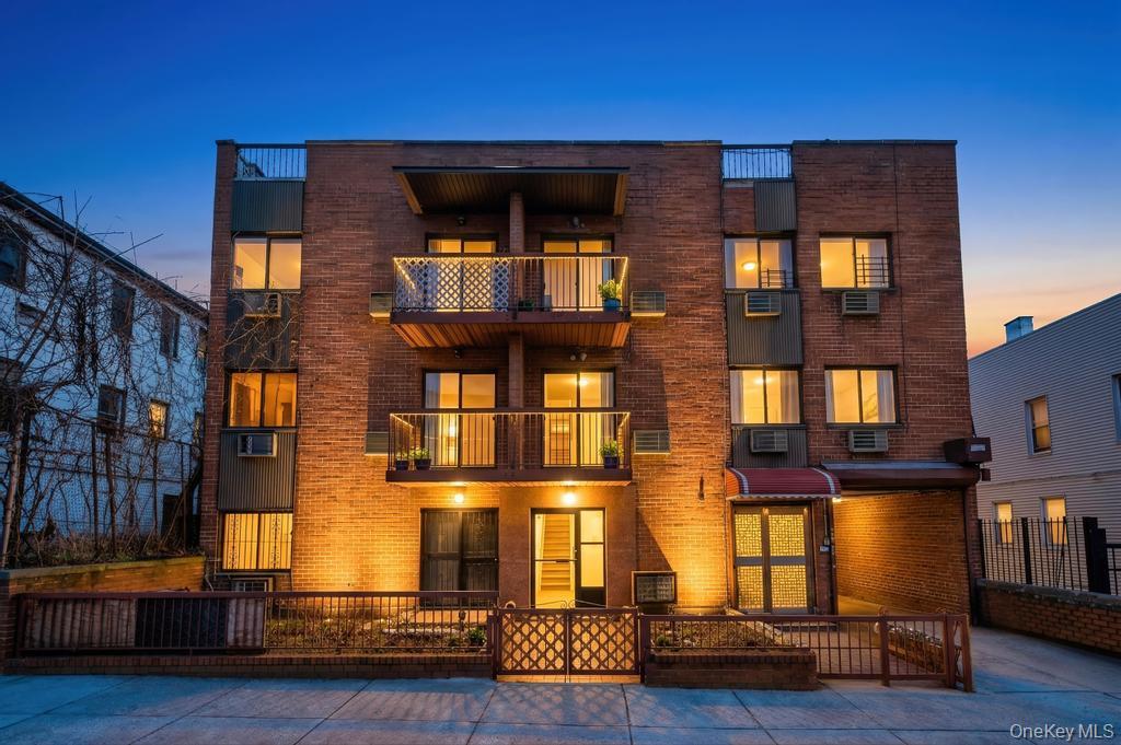 42-11 108th Street, Unit 1A Queens, NY 11368 - Photo 2 of 16 a front view of building with multiple windows