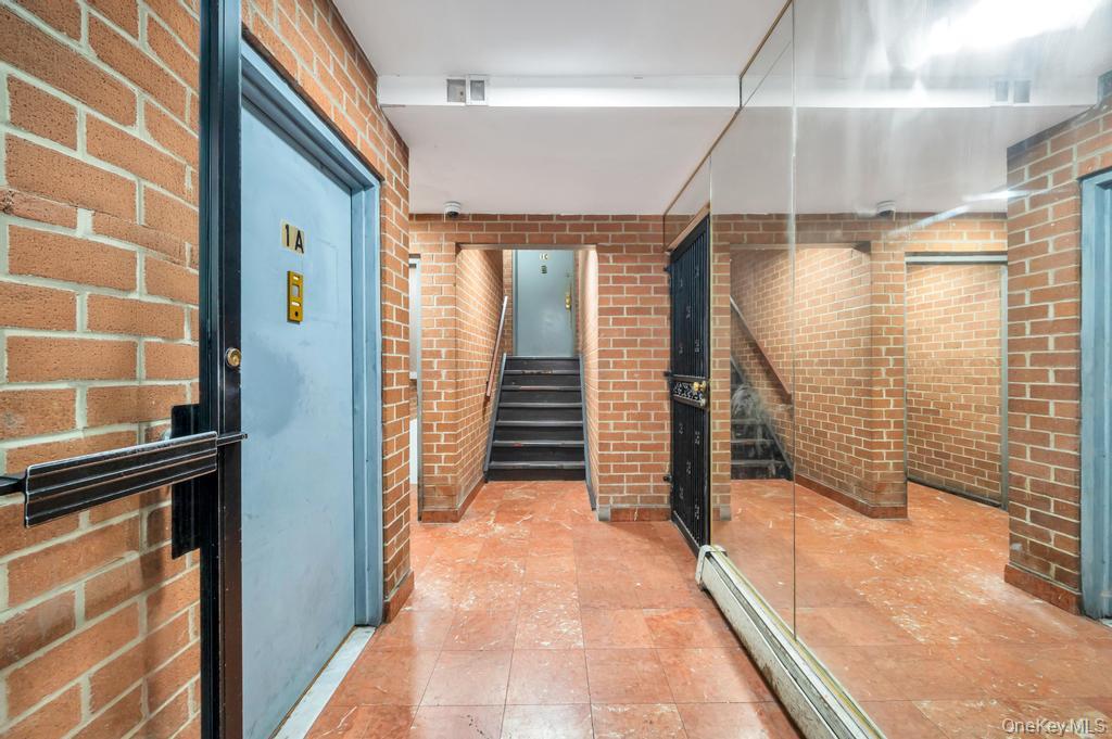 42-11 108th Street, Unit 1A Queens, NY 11368 - Photo 3 of 16 a view of a hallway with stairs