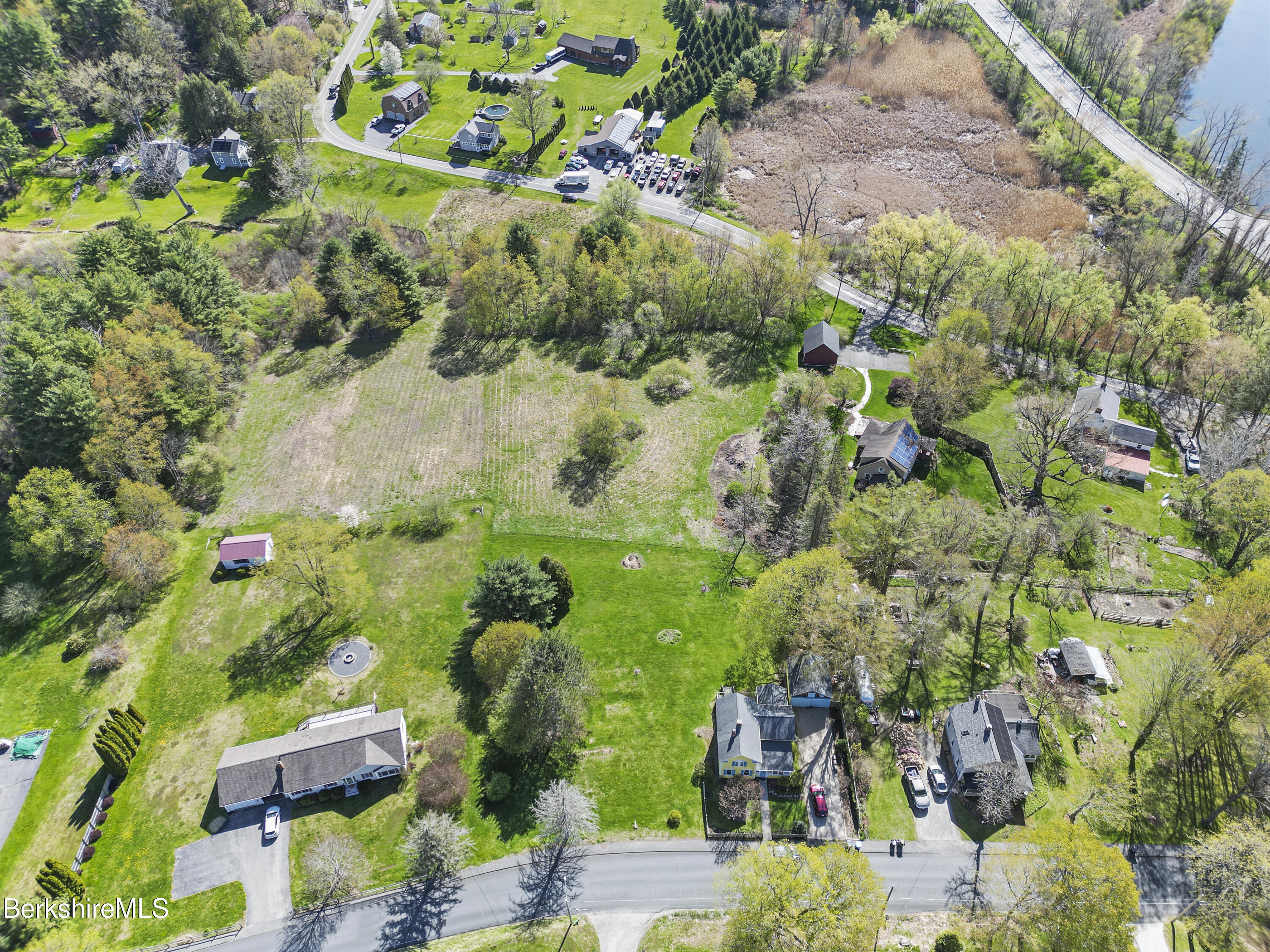 0 Church Street Lee, MA 01238 - Photo 12 of 16 an aerial view of a residential houses with yard