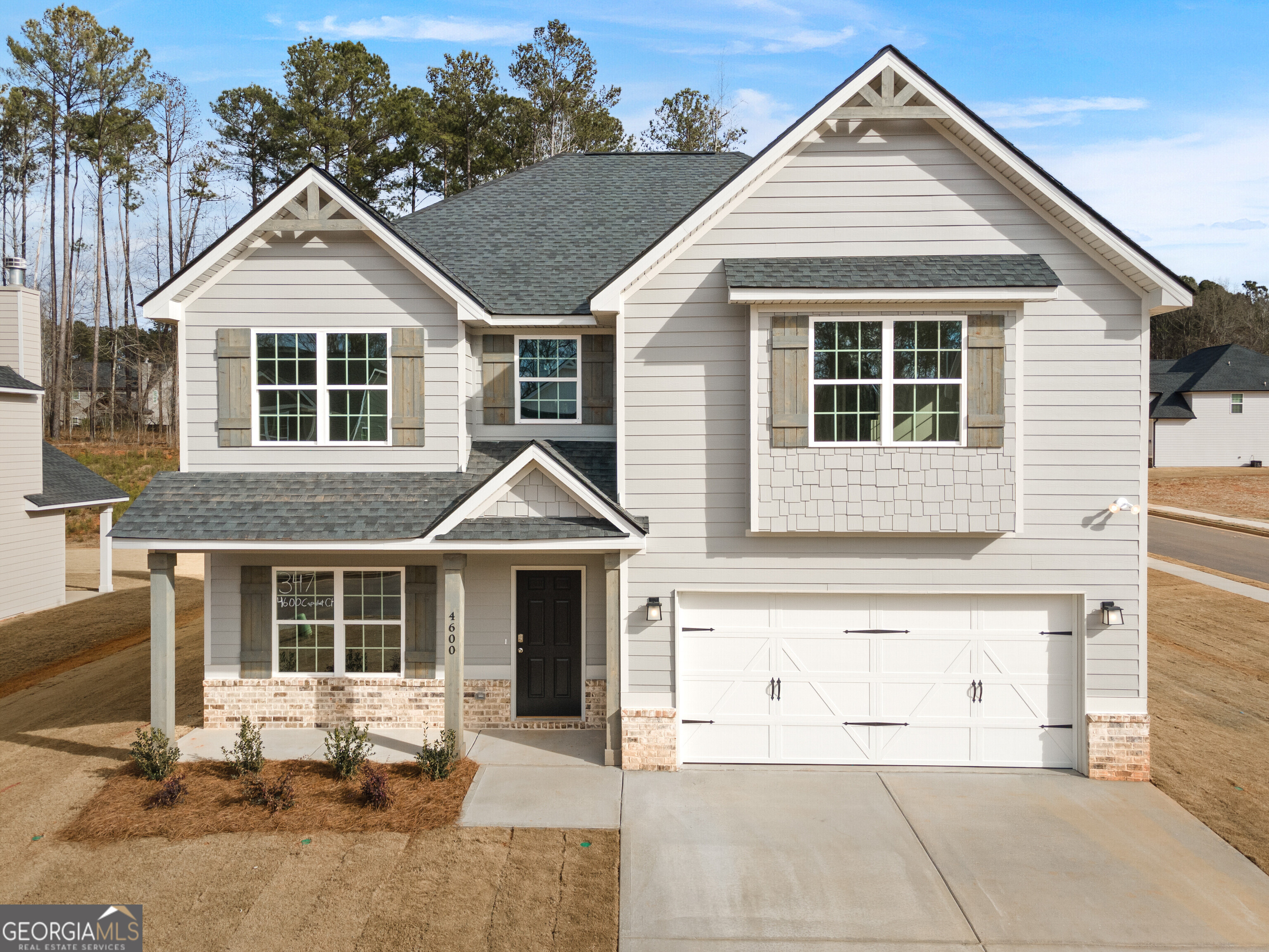 4600 Capulet Court Forsyth, GA 31029 - Photo 1 of 68 a front view of a house with a yard outdoor seating and garage