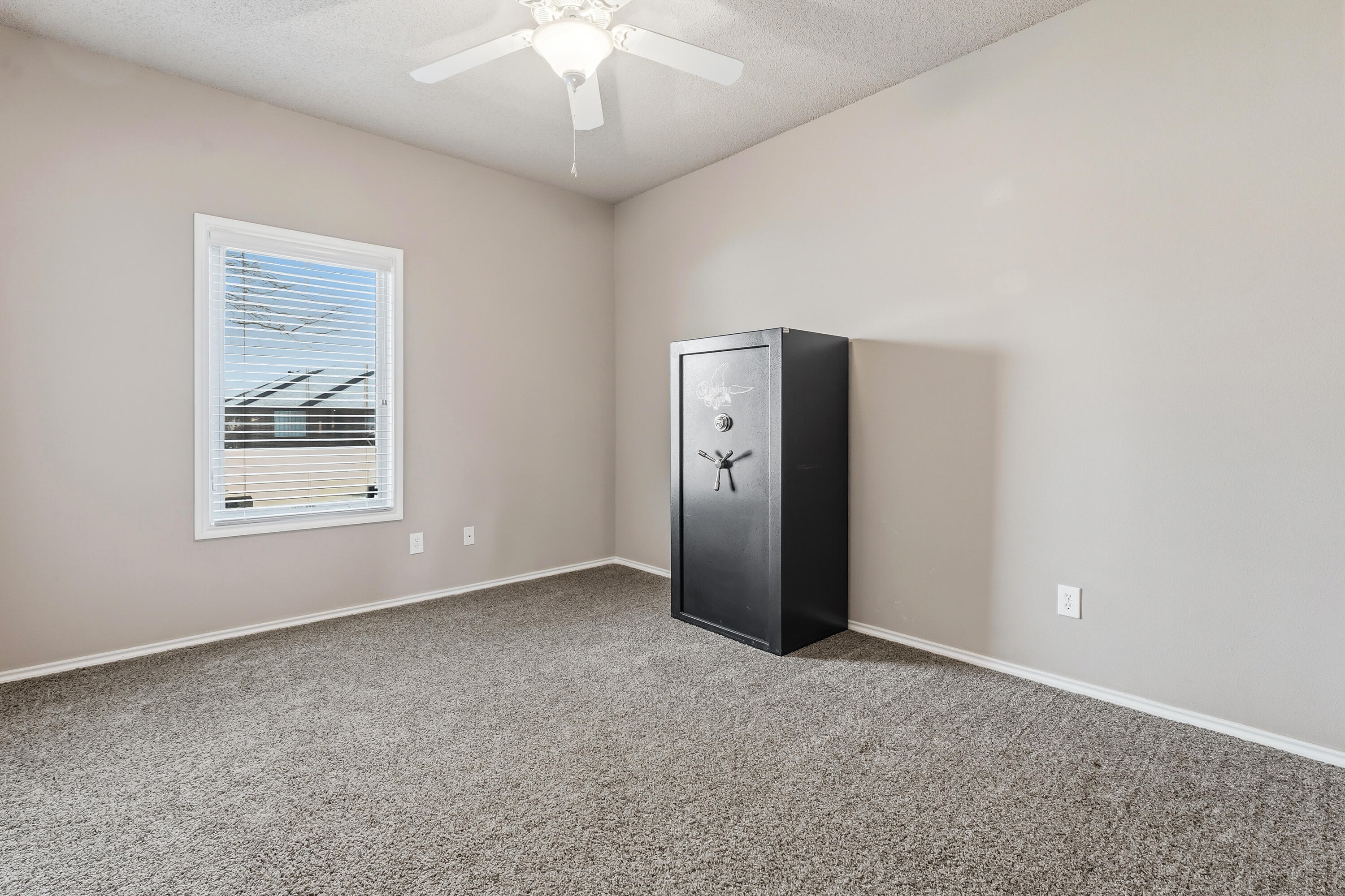 3017 104th Street Lubbock, TX 79423 - Photo 20 of 28 an empty room with chandelier fan