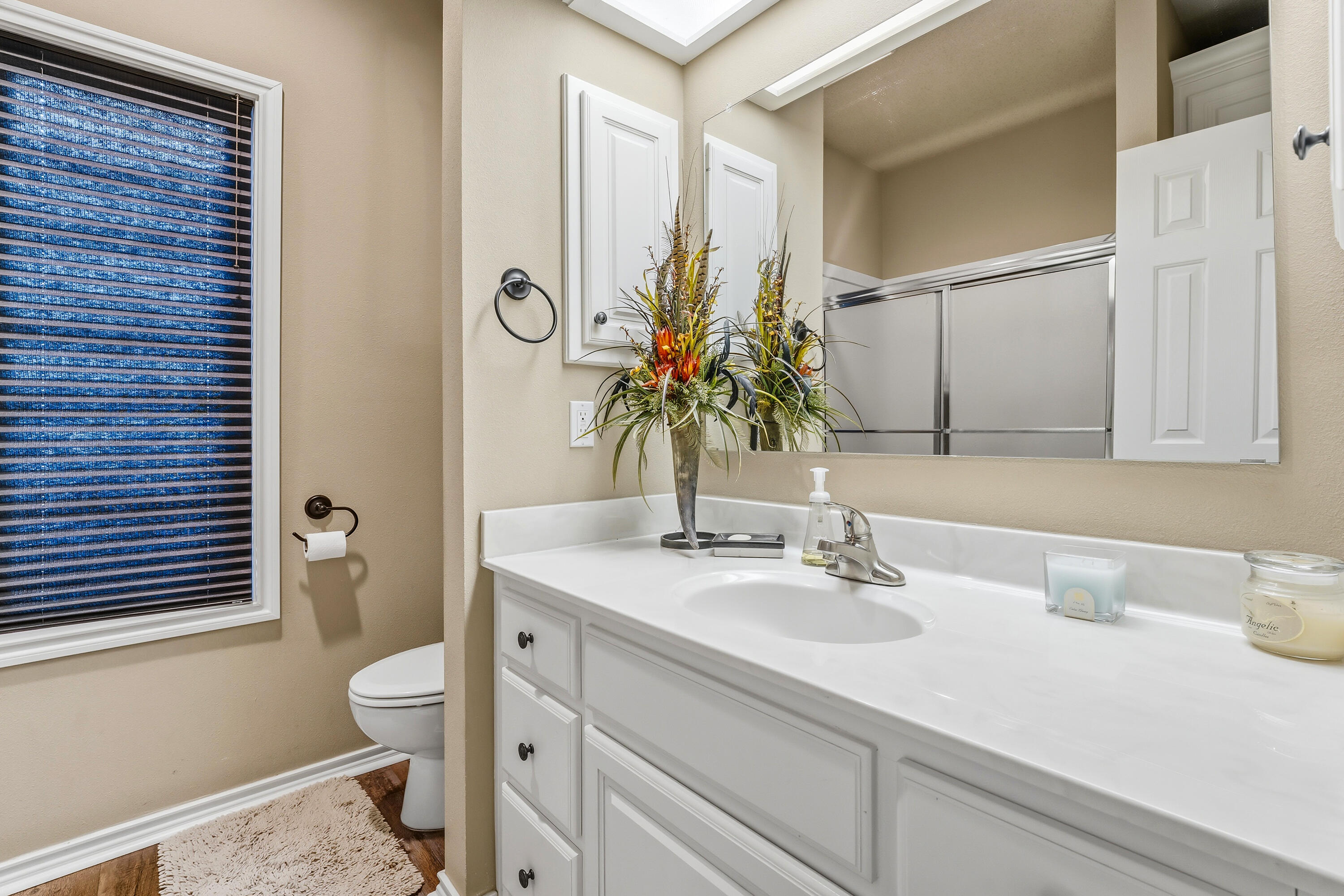 3017 104th Street Lubbock, TX 79423 - Photo 22 of 28 a bathroom with a sink toilet and shower