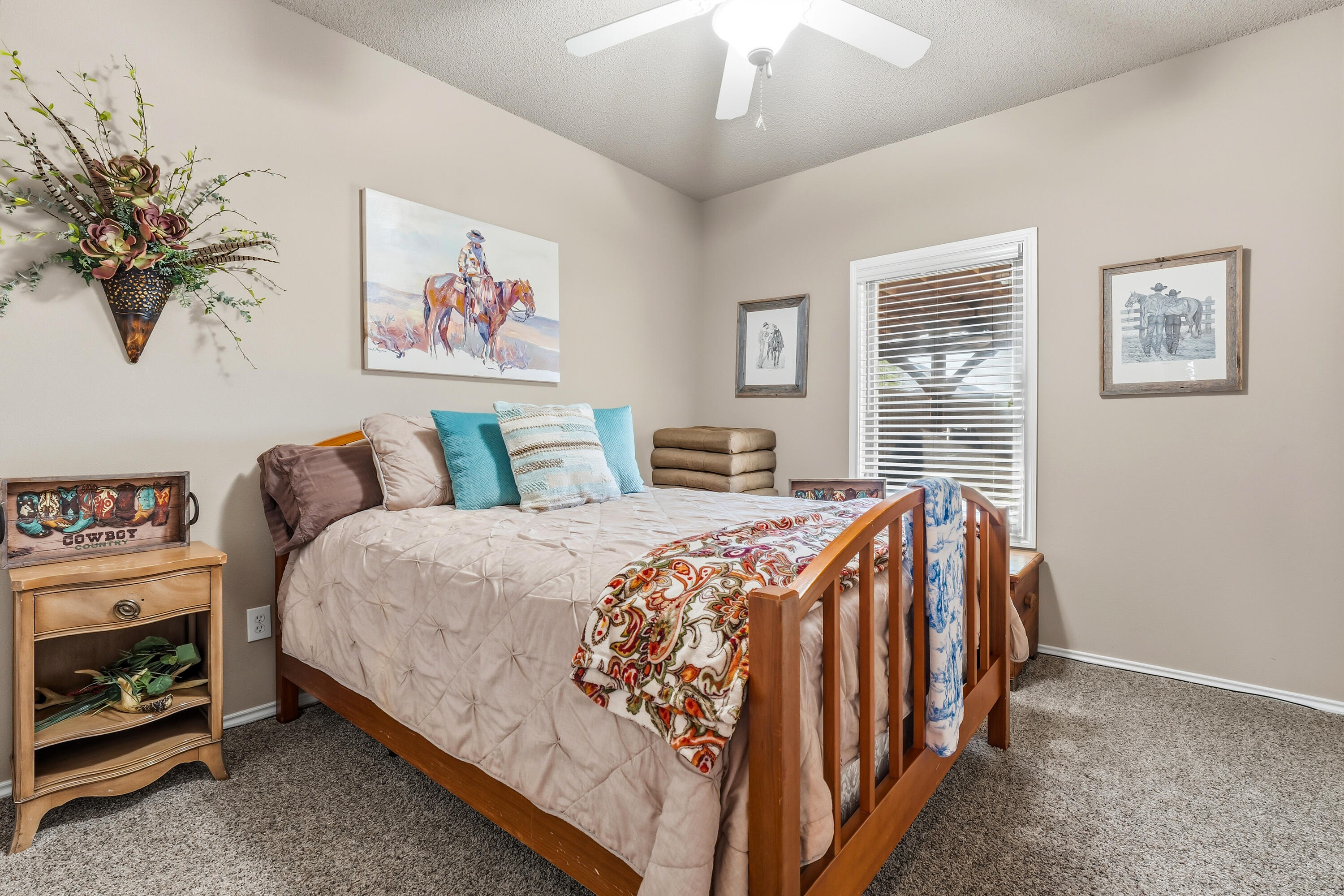 3017 104th Street Lubbock, TX 79423 - Photo 23 of 28 a bed sitting in a bedroom next to a window
