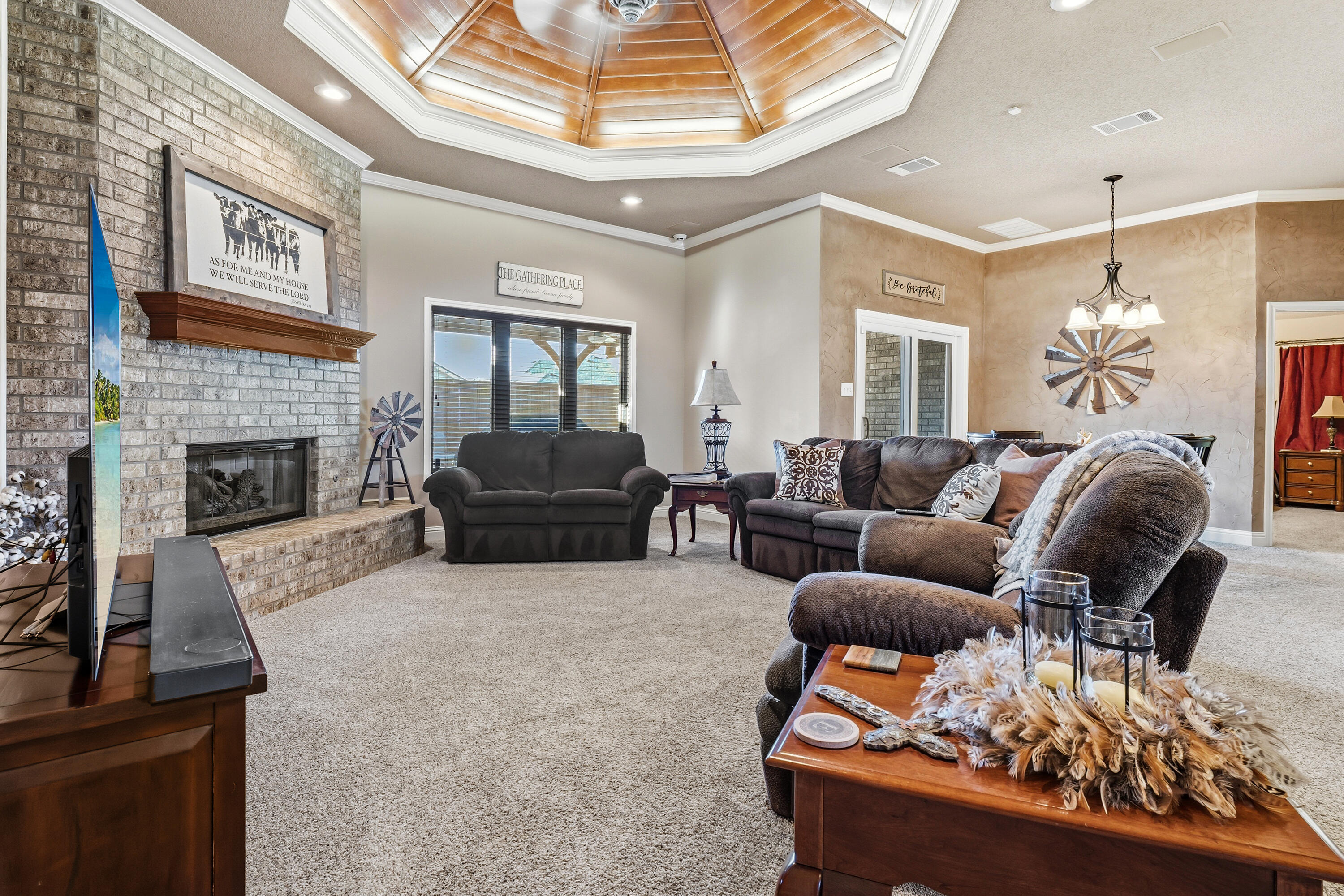 3017 104th Street Lubbock, TX 79423 - Photo 5 of 28 a living room with furniture and a fireplace