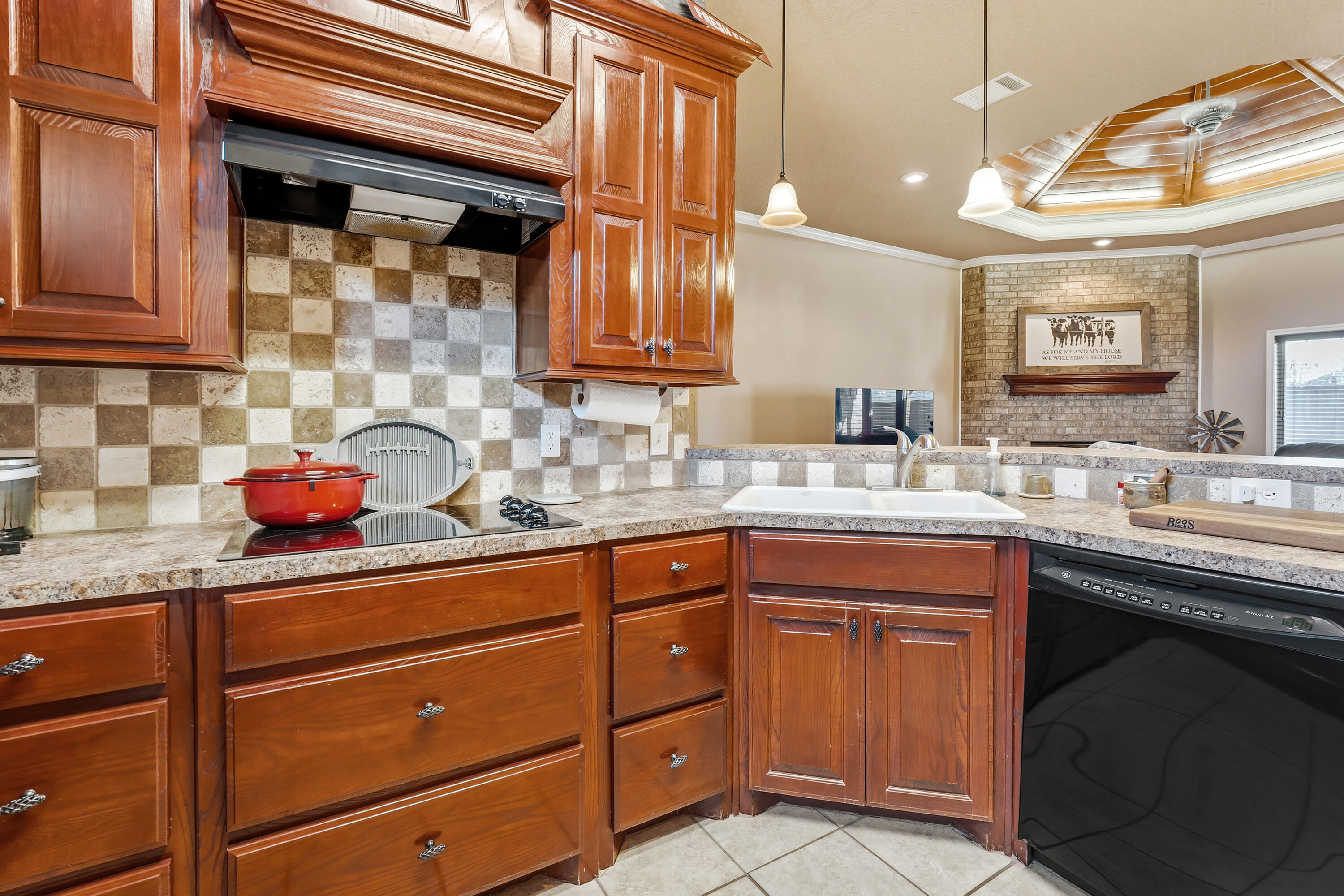 3017 104th Street Lubbock, TX 79423 - Photo 10 of 28 a kitchen with a sink and cabinets