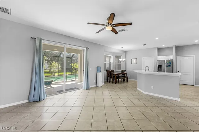 a kitchen with white cabinets appliances and sink
