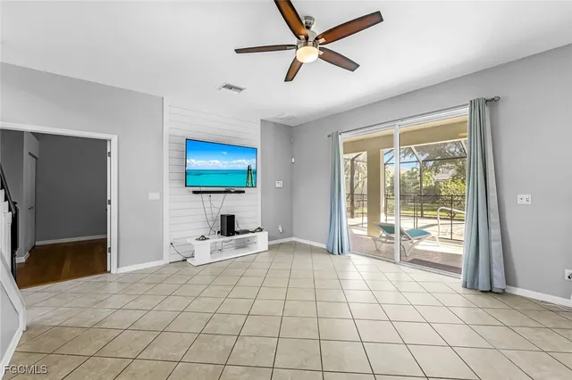 a view of a room with wooden floor and outdoor space