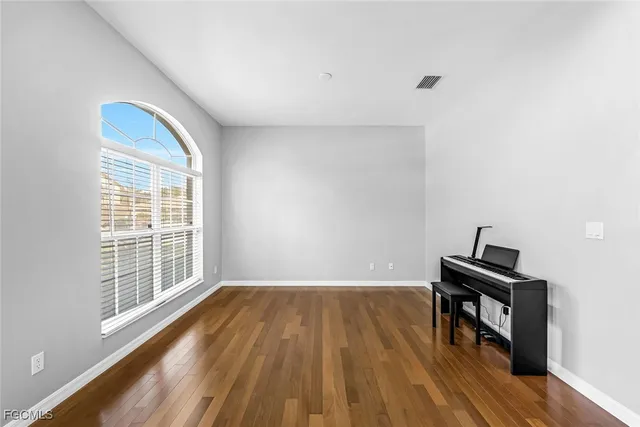 a bedroom with bed and window