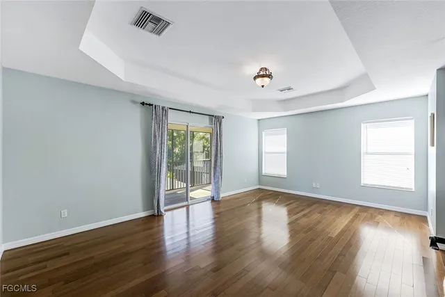 a spacious bathroom with a tub sink shower and mirror