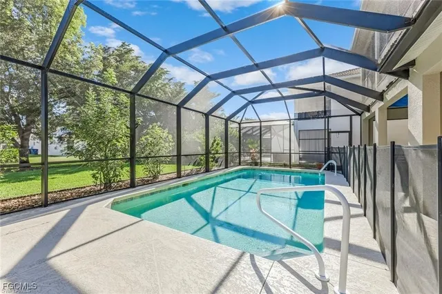 a view of a backyard with a swimming pool