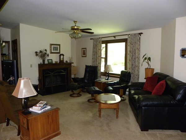 69 Gale Road Charlton, MA 01507 - Photo 8 of 30 a living room with furniture a rug and a chandelier