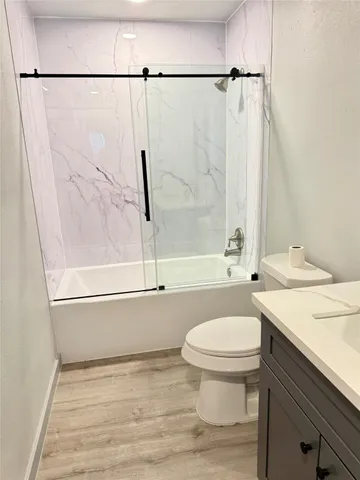 a bathroom with a sink a toilet and a bathtub