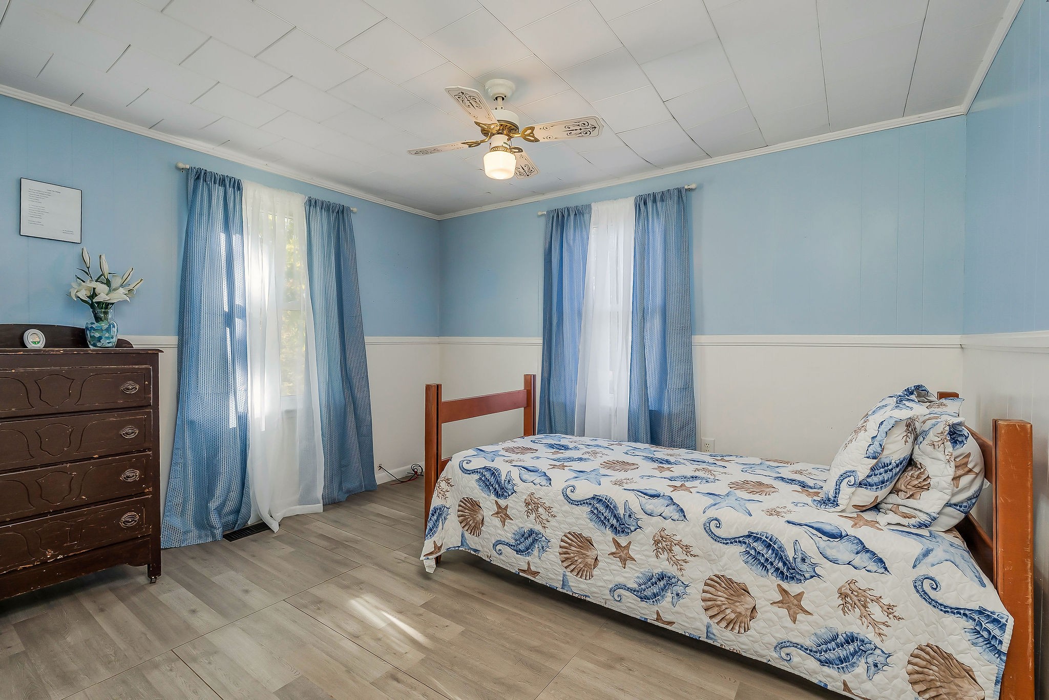 2634 Pine Grove Road Spencer, TN 38585 - Photo 12 of 33 a bedroom with a bed and a chandelier