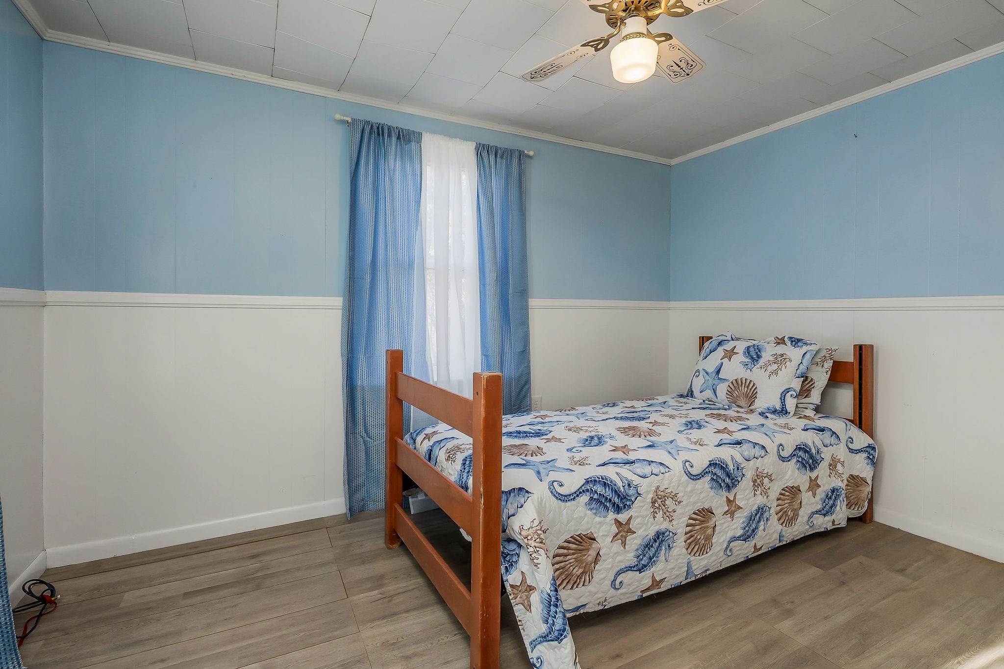 2634 Pine Grove Road Spencer, TN 38585 - Photo 13 of 33 a bedroom with a bed and a chandelier