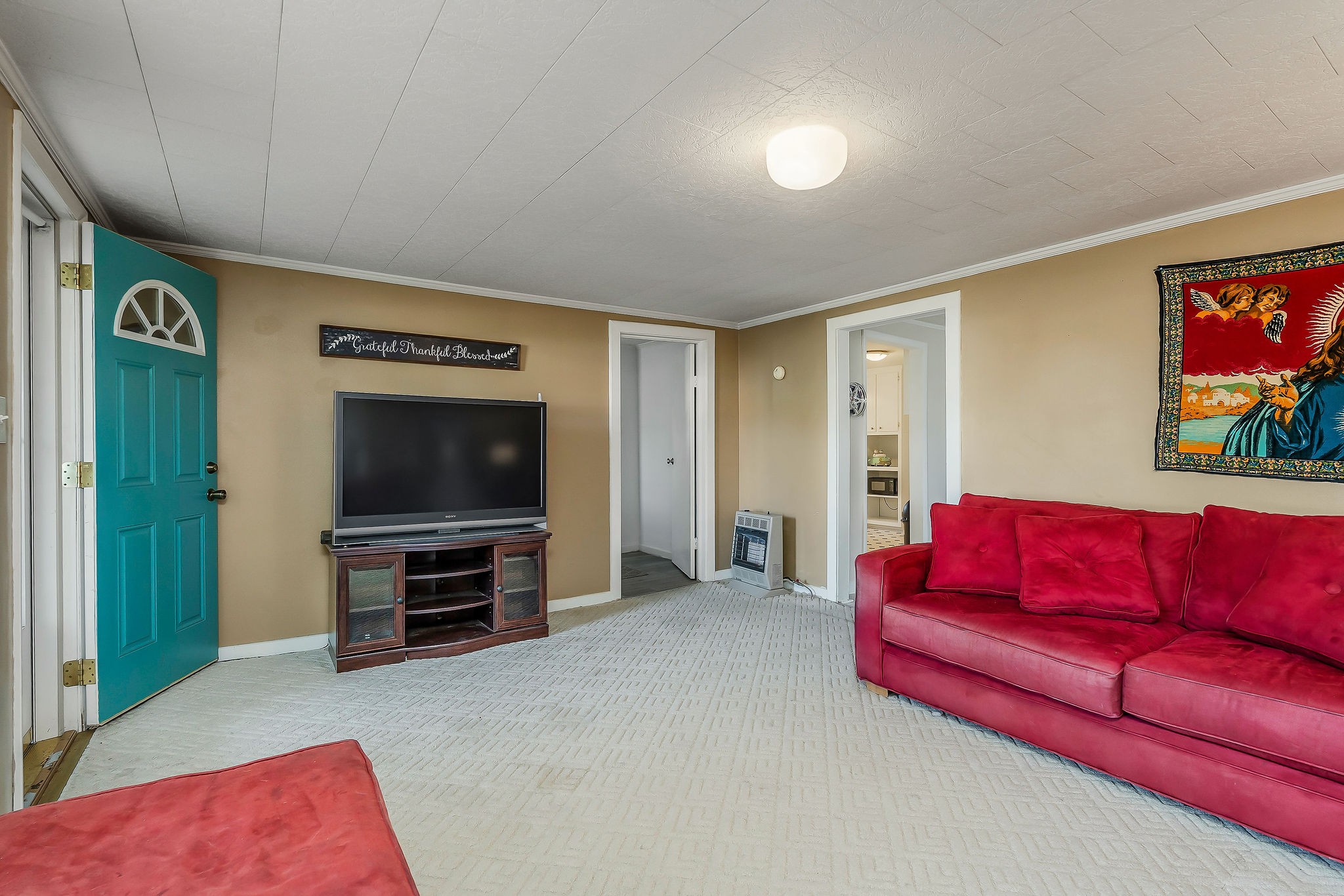 2634 Pine Grove Road Spencer, TN 38585 - Photo 4 of 33 a living room with furniture and a flat screen tv