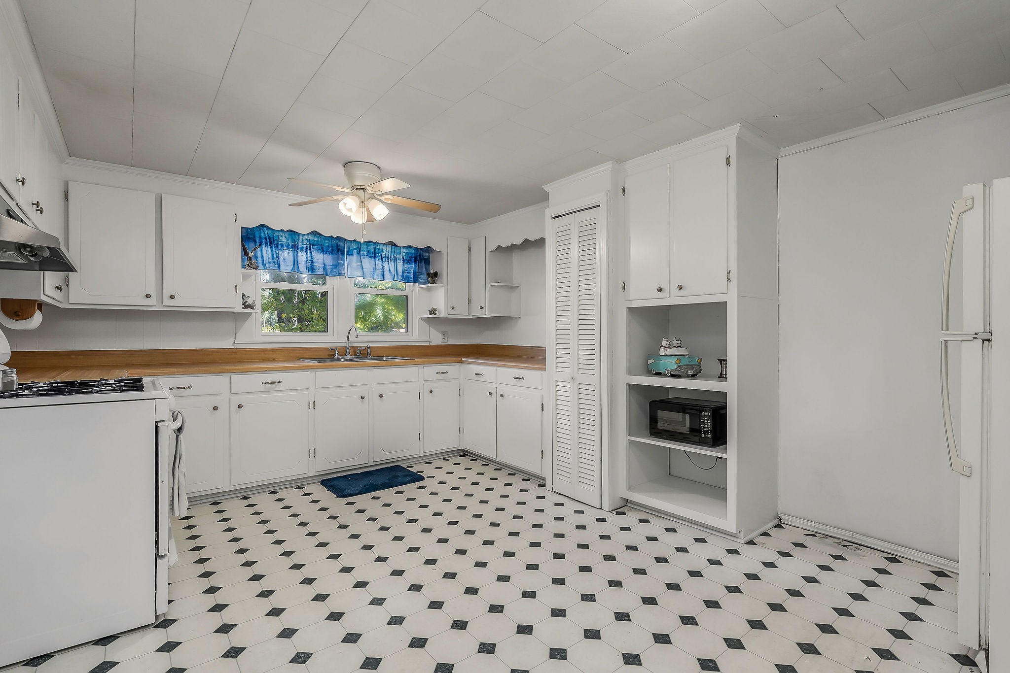 2634 Pine Grove Road Spencer, TN 38585 - Photo 5 of 33 a kitchen with a sink a stove a refrigerator and cabinets