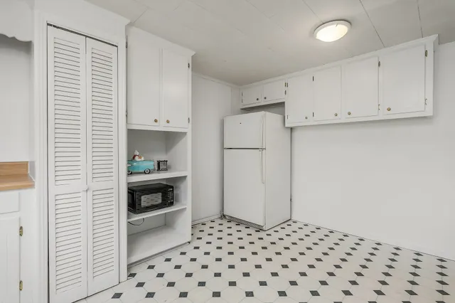 a kitchen with a cabinets and a stove