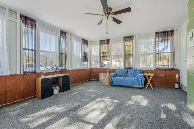 a spacious bedroom with a large bed and a couch