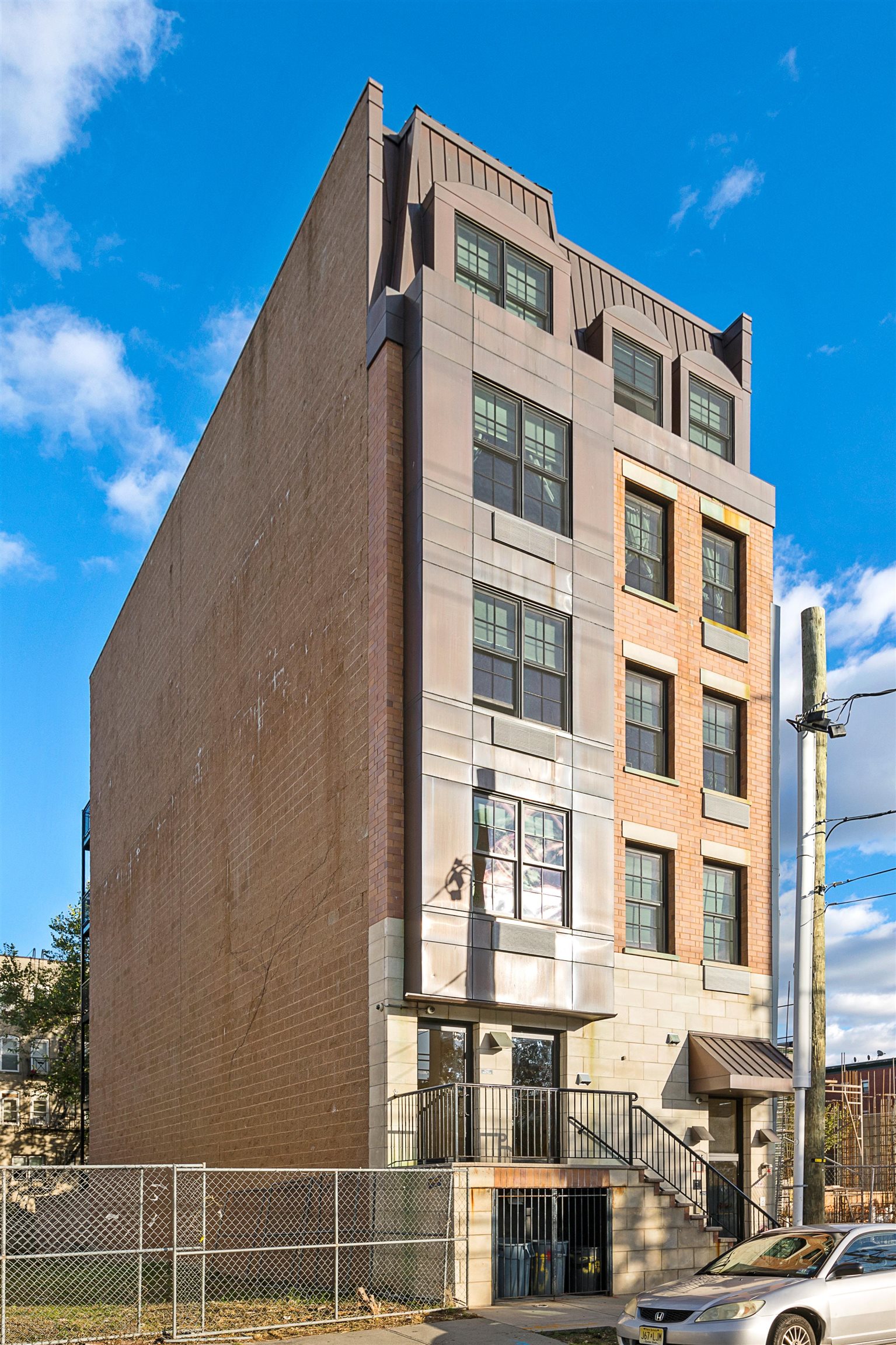 415 Jackson Street, Unit 4R Hoboken, NJ 07030 - Photo 13 of 13 a front view of a building with a street