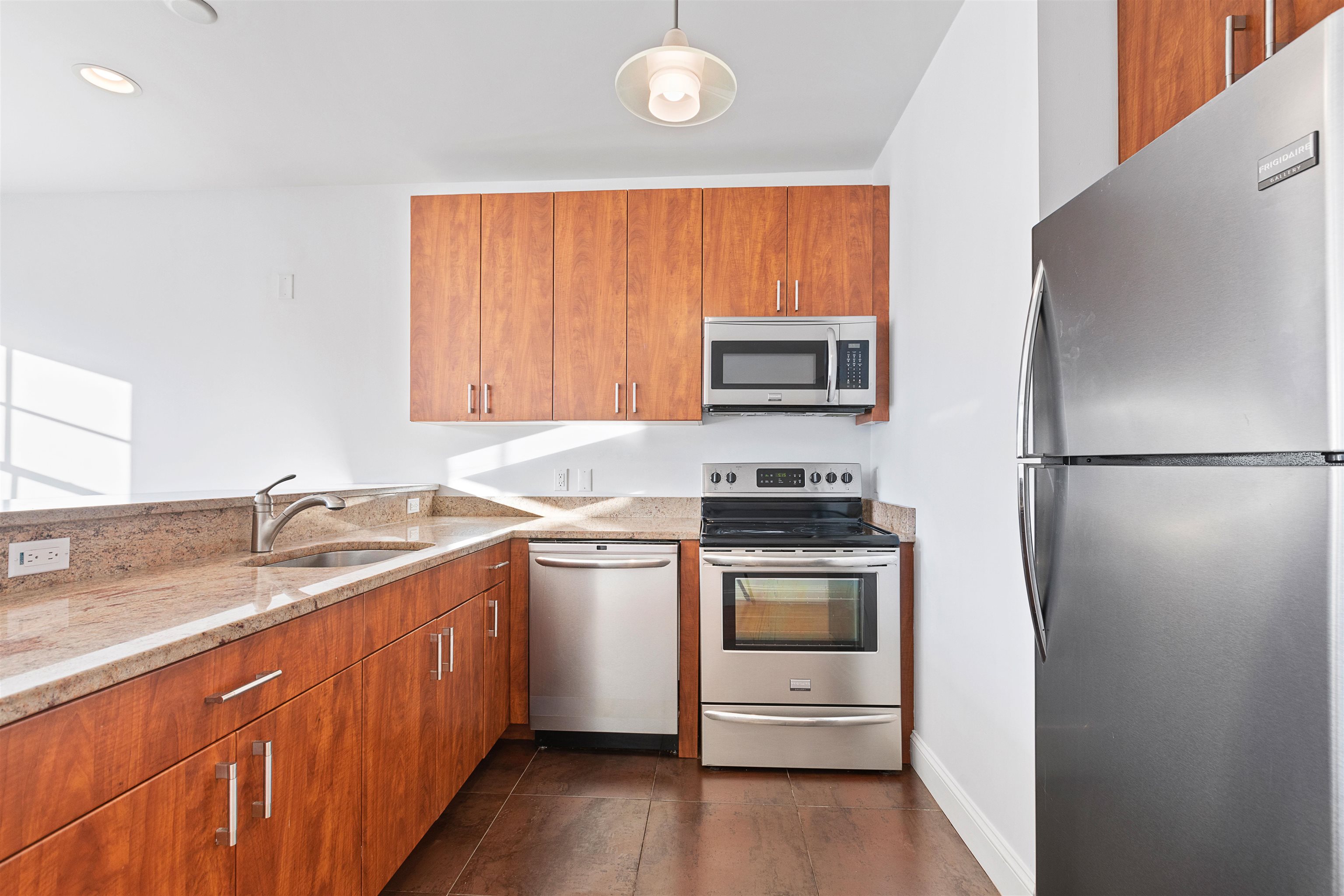 415 Jackson Street, Unit 4R Hoboken, NJ 07030 - Photo 2 of 13 a kitchen with a sink stove and refrigerator