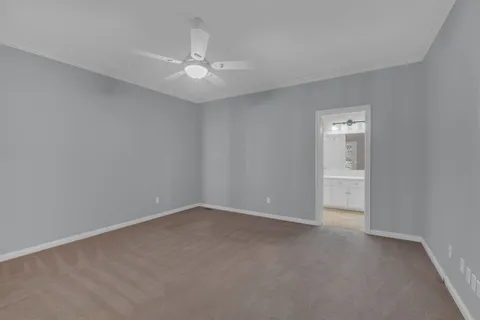 a view of an empty room with a fan