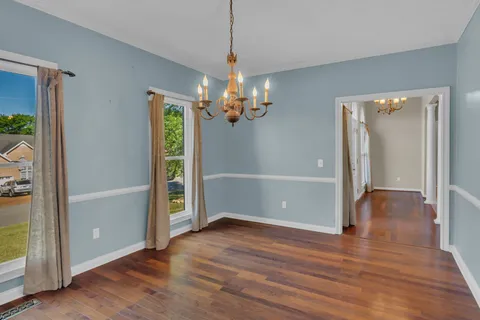 a view of a livingroom with wooden floor