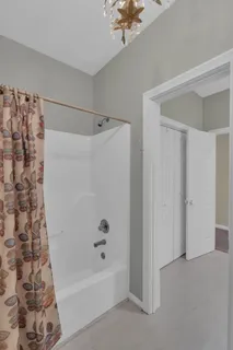 a bathroom with a bathtub and a shower