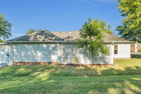 a view of a back yard of the house
