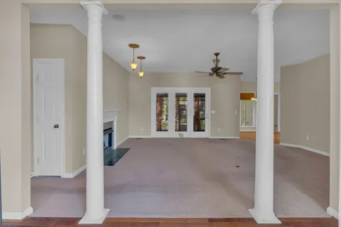 a view of a hallway with windows