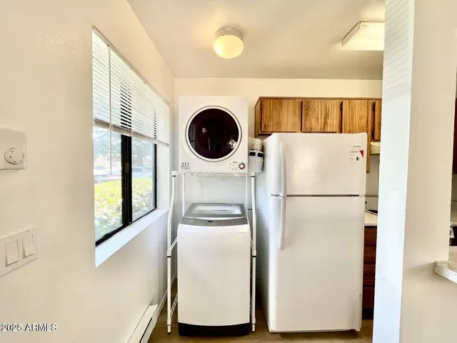 a white refrigerator freezer sitting in a kitchen
